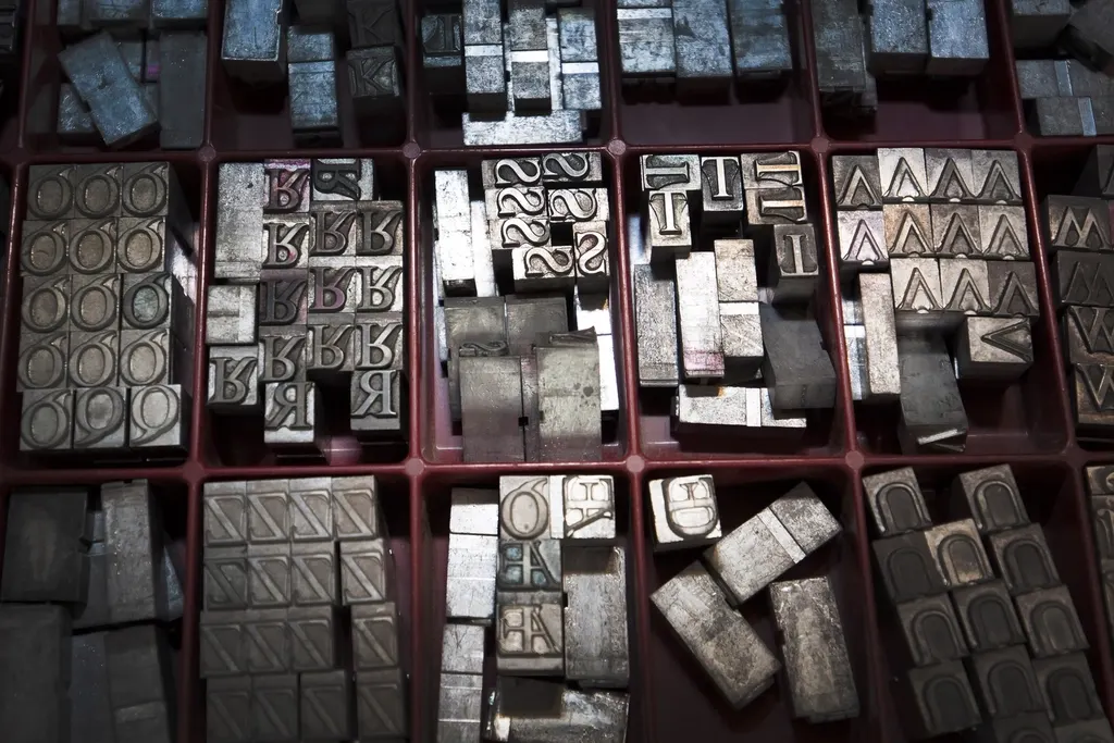 Brand fonts: a tray of metal letterpress type in different typefaces