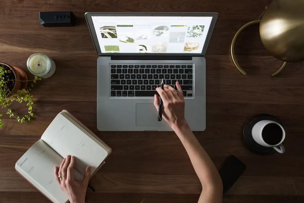 Business blog being written on a laptop, seen from above