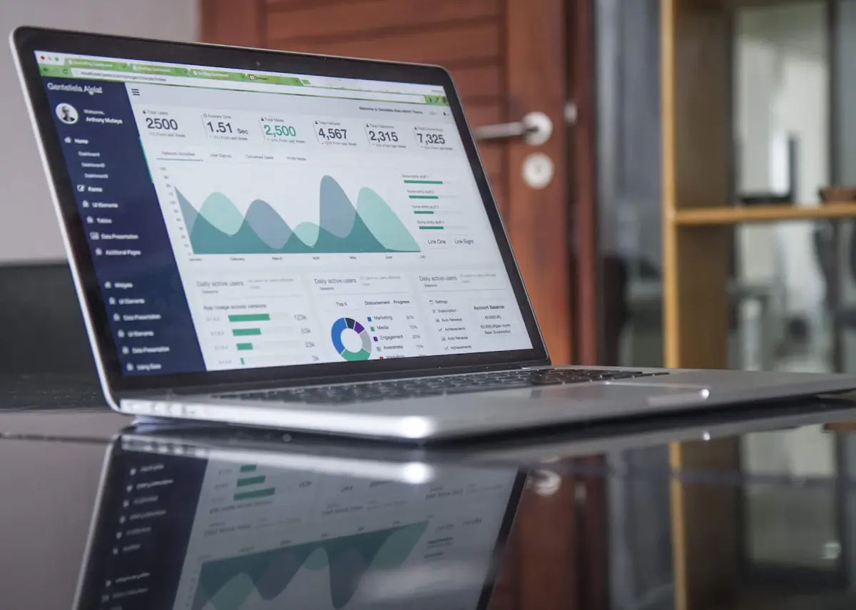 SEO audit data on a laptop showing a website analytics dashboard with traffic charts